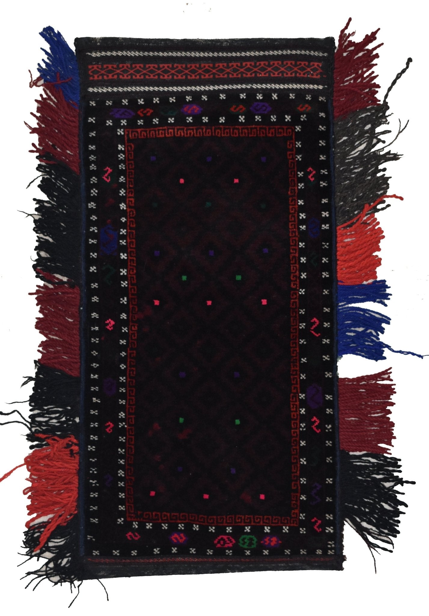 A vintage handmade Afghan Baluch wool cushion featuring a dark geometric pattern and side tassels.