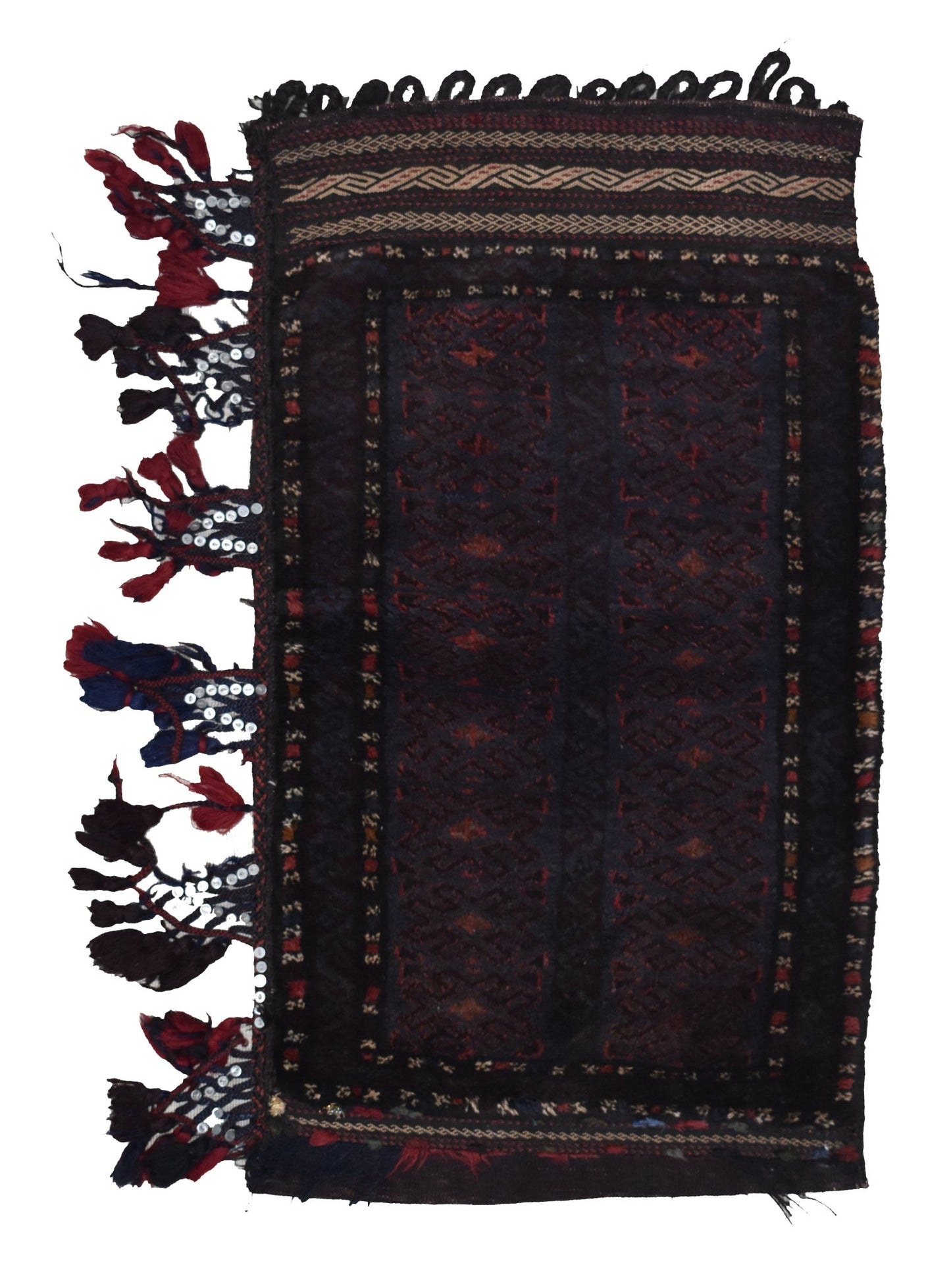 A vintage handmade Afghan Baluch wool cushion featuring dark geometric patterns and side tassels.