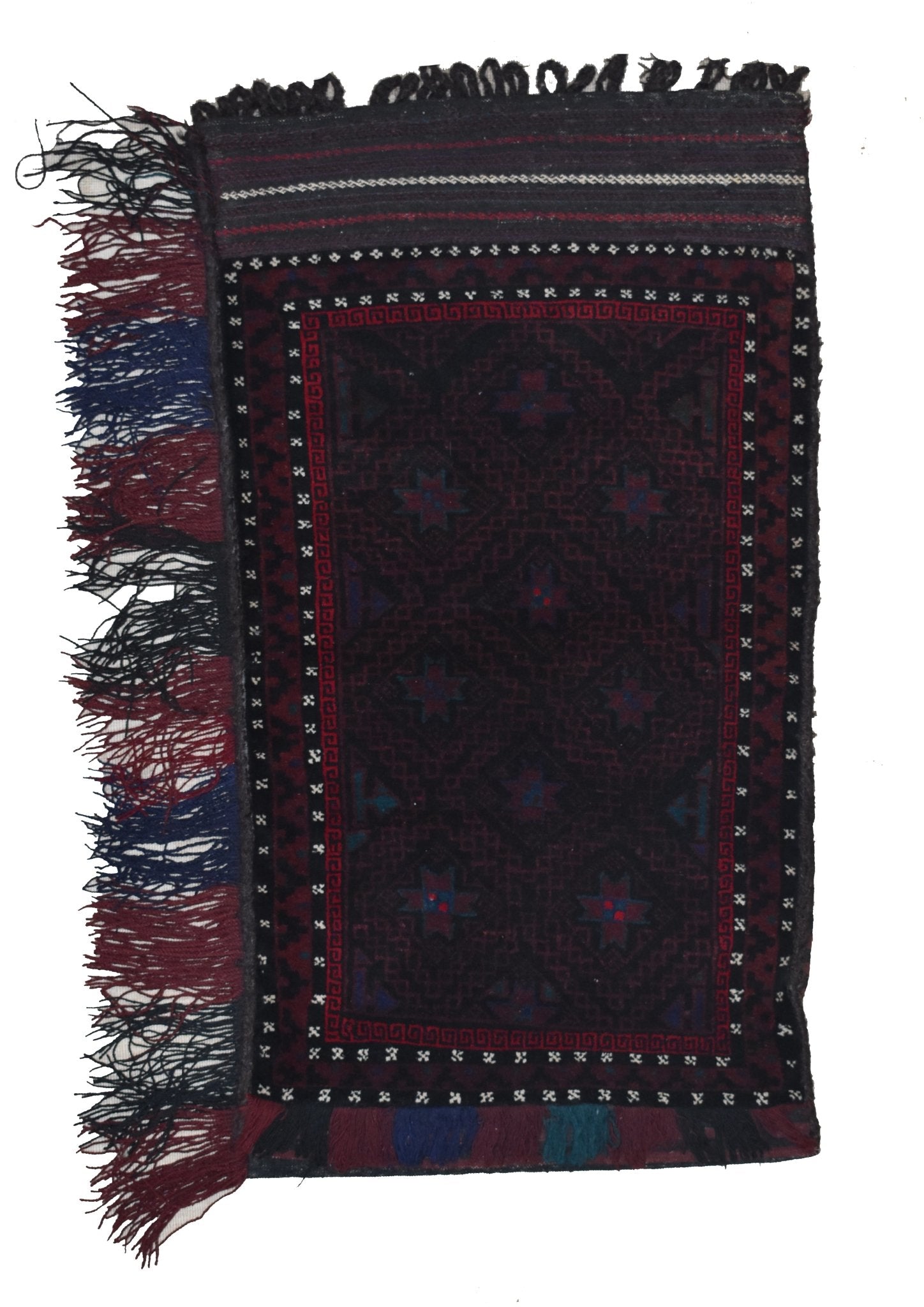 A handmade vintage Afghan Baluch wool cushion featuring a dark geometric pattern and fringe.