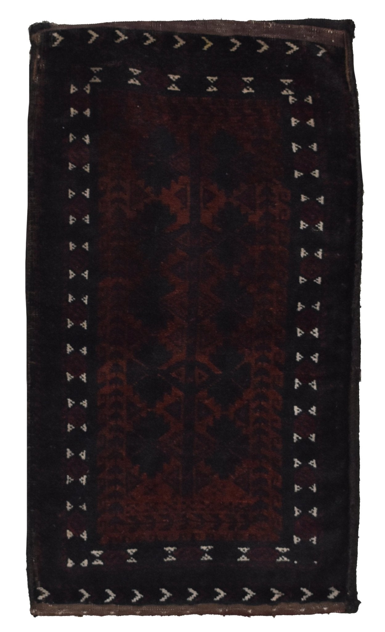 A rectangular vintage Afghan Baluch wool cushion featuring a dark geometric tribal pattern.
