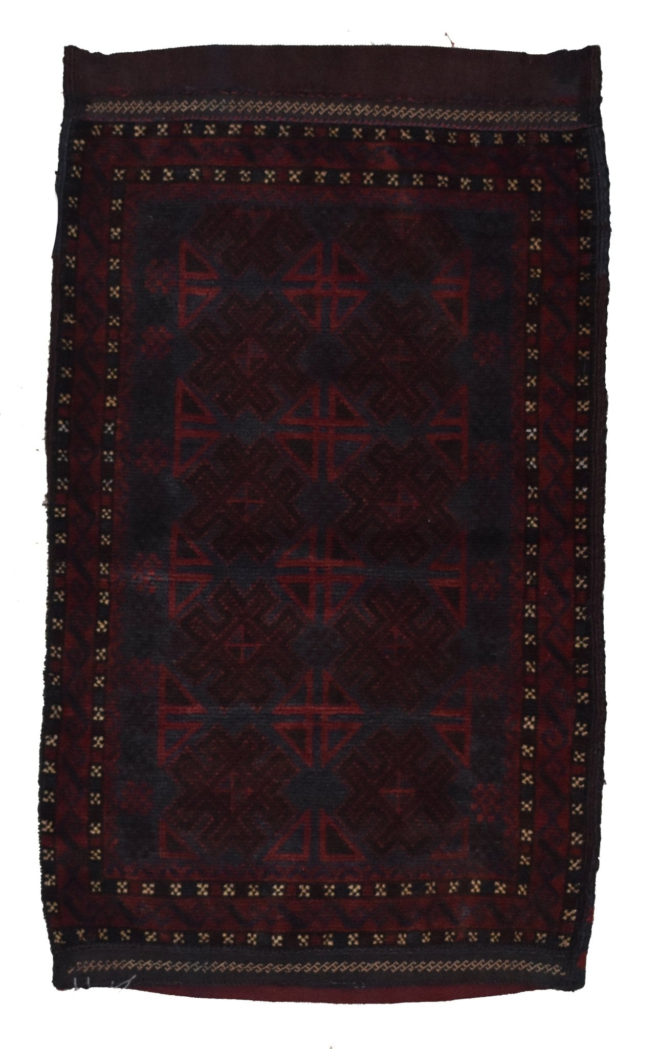 A rectangular vintage Afghan Baluch wool cushion featuring dark red geometric tribal patterns.