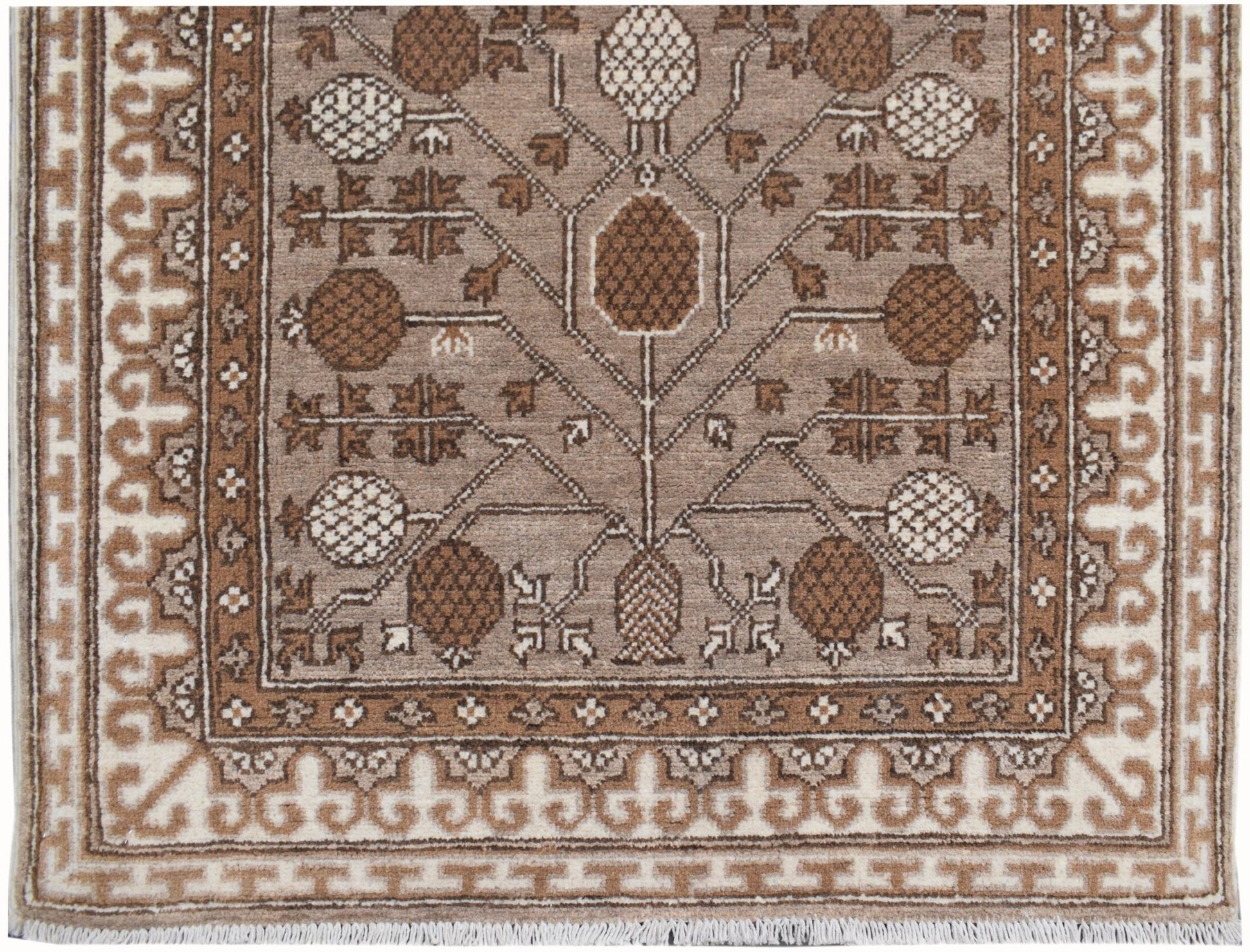 A handmade Afghan Chobi runner featuring a brown and cream geometric tree of life pattern.