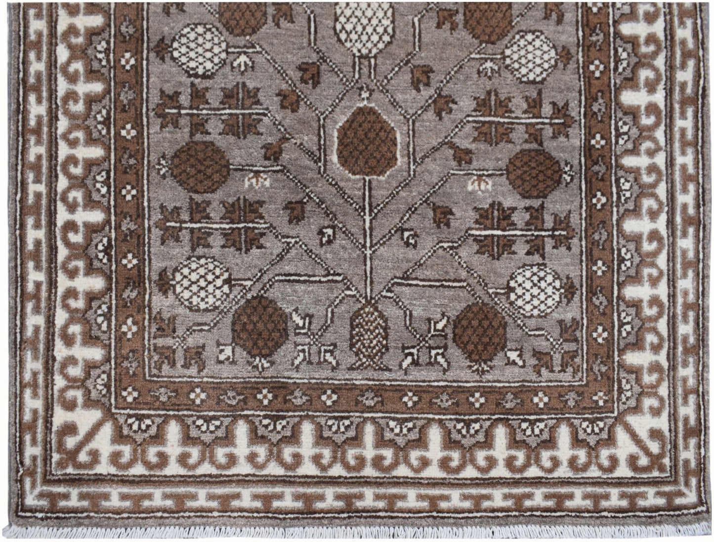 Handmade Afghan Chobi runner rug featuring a brown and cream geometric tree of life pattern.