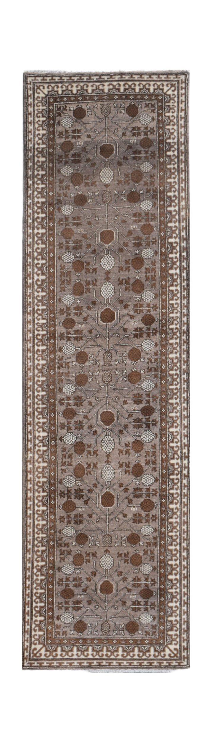 Handmade Afghan Chobi runner rug featuring a brown and cream geometric floral pattern.