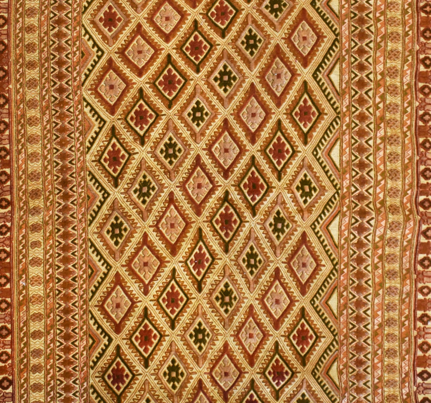 Handmade Afghan Mashwani rug featuring intricate geometric diamond patterns in warm earth tones.