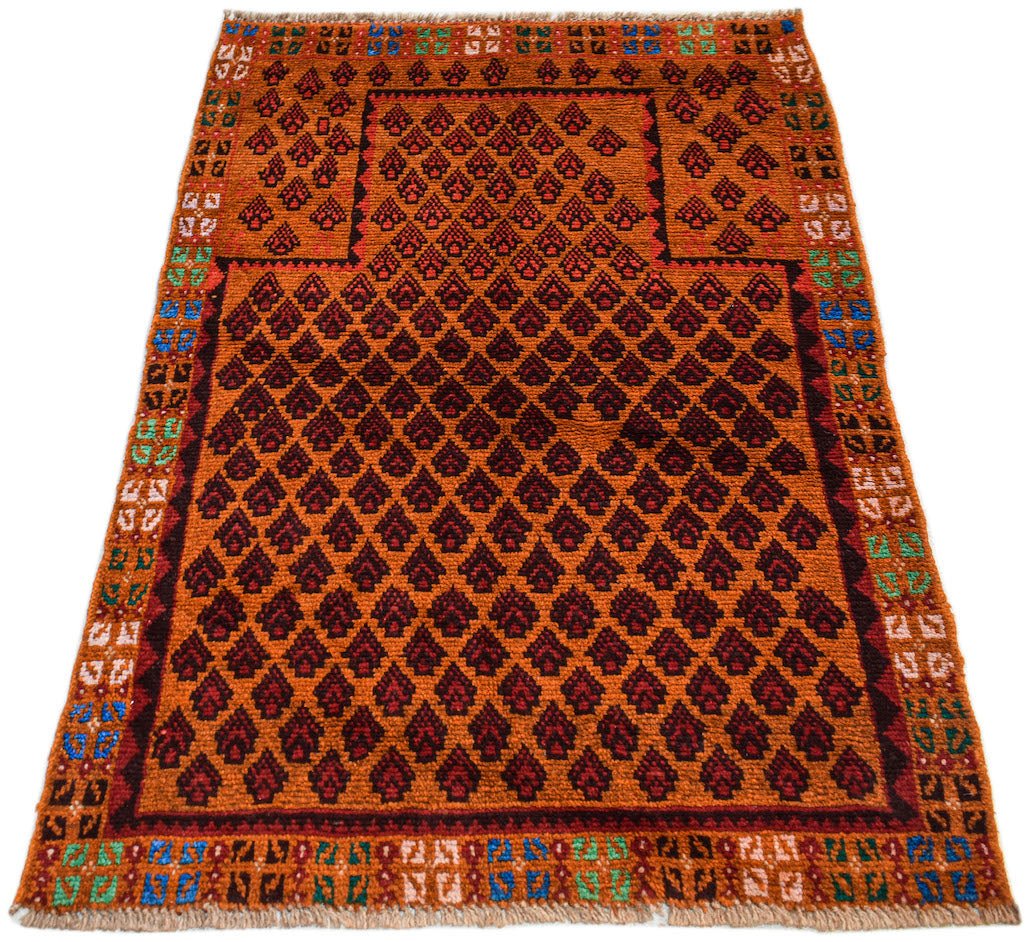 Handmade Afghan Pashm rug featuring a repeating dark diamond pattern on an orange wool background.