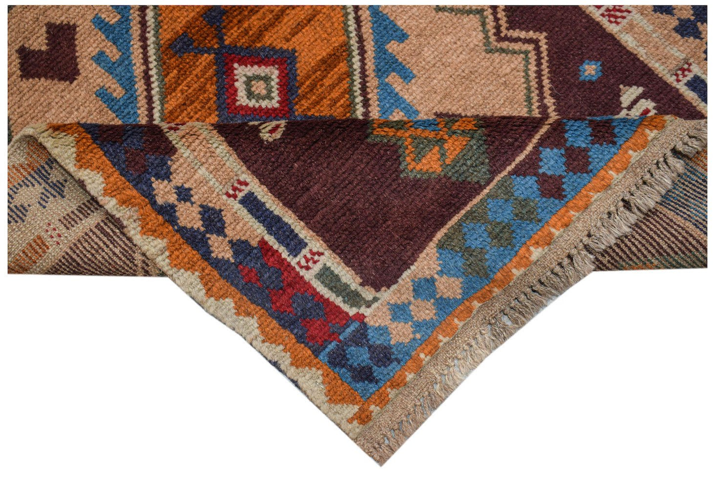A handmade Afghan Pashm rug featuring geometric tribal patterns in shades of red, blue, and brown.