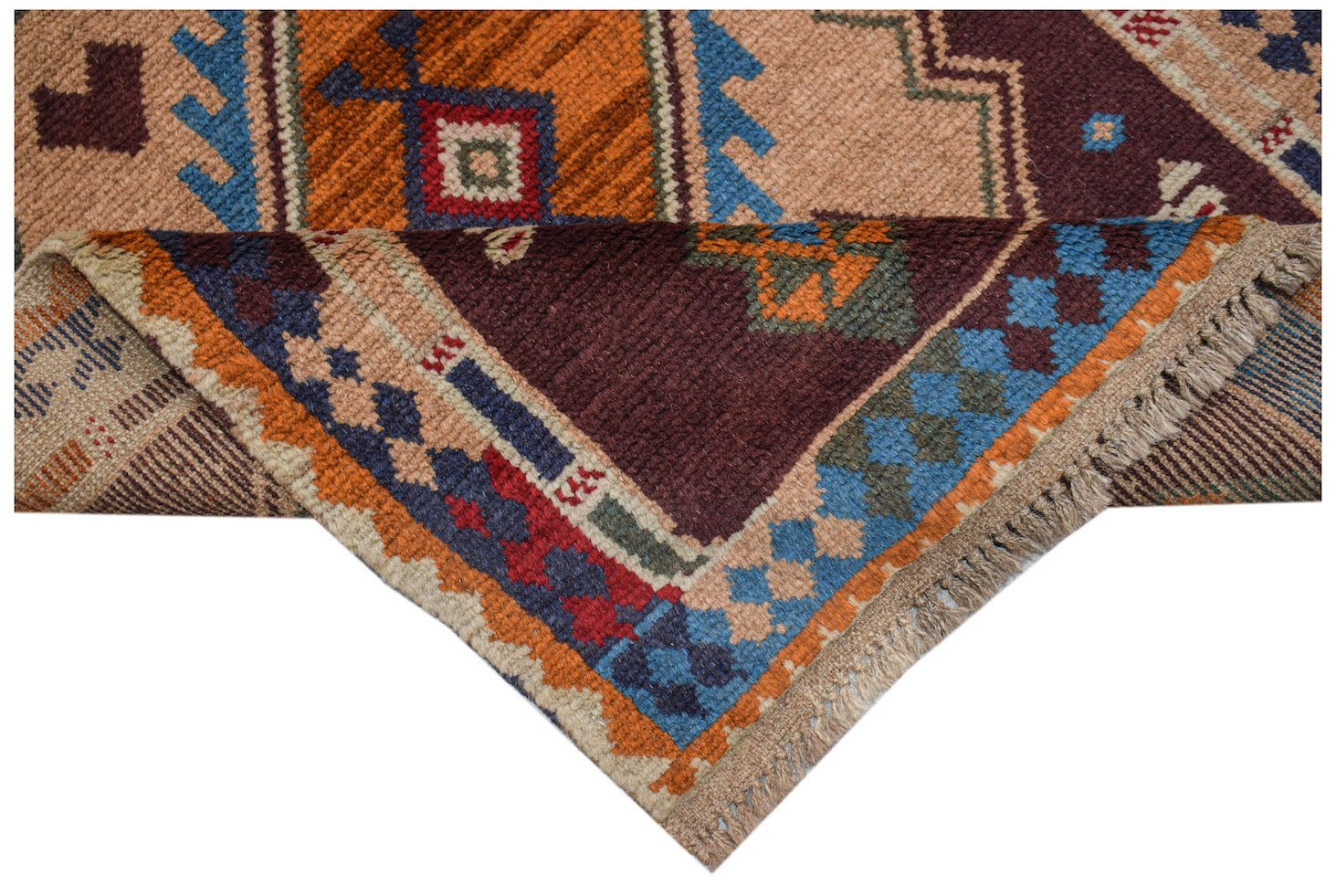 A handmade Afghan Pashm rug featuring geometric tribal patterns in shades of red, blue, and brown.