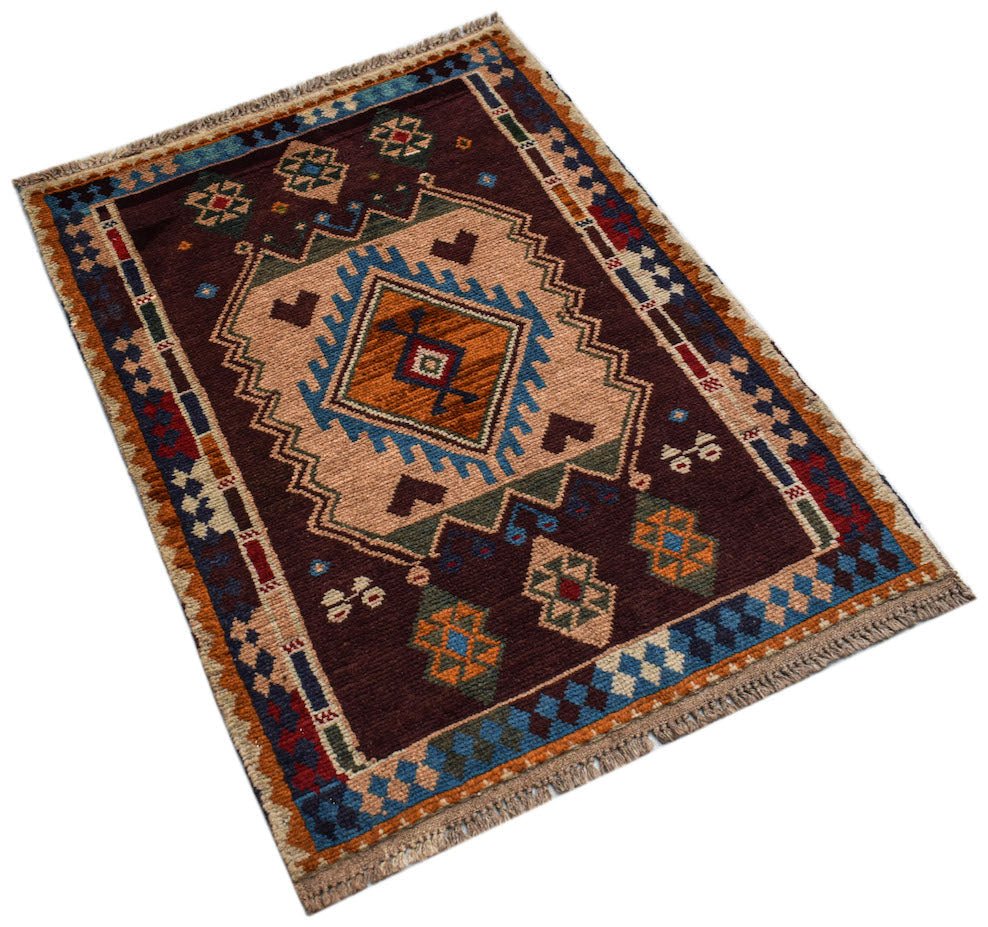 Handmade Afghan Pashm rug featuring a geometric tribal pattern in shades of brown, blue, and orange.