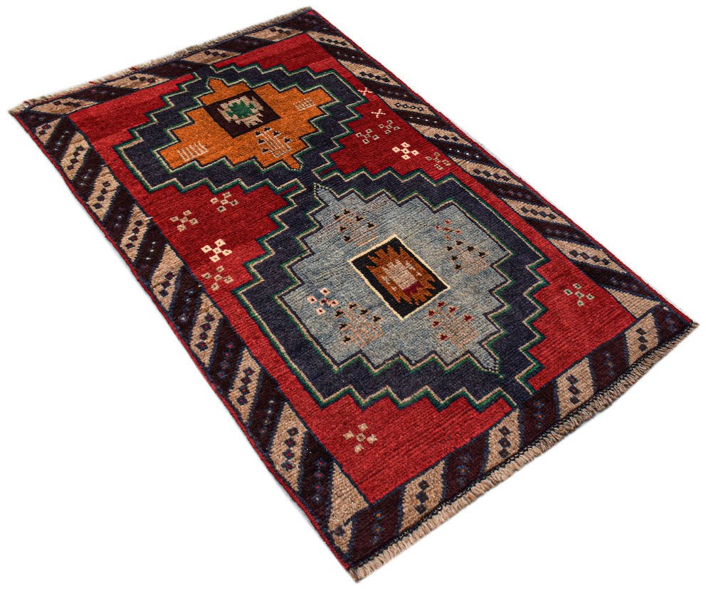 Handmade Afghan Pashm rug featuring a geometric tribal pattern in red, blue, and brown tones.
