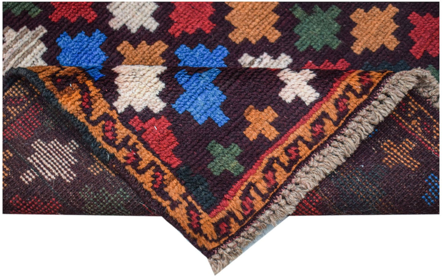 A handmade Afghan Pashm rug featuring a dark brown field with colorful geometric motifs.