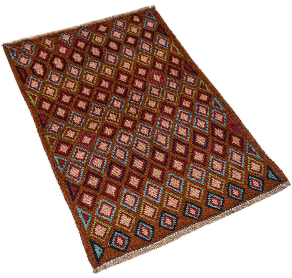 A handmade Afghan Pashm rug featuring a repeating diamond pattern in brown, blue, and red tones.
