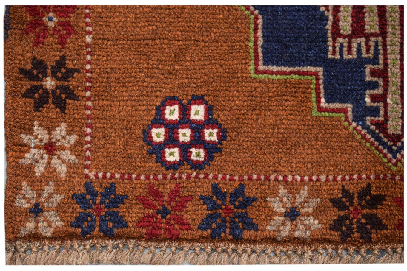 Handmade Afghan Pashm rug featuring a brown field with geometric floral motifs and a fringed edge.