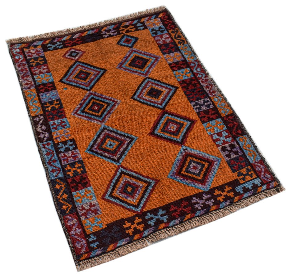 Handmade Afghan Pashm rug featuring a vibrant orange field with geometric diamond patterns.