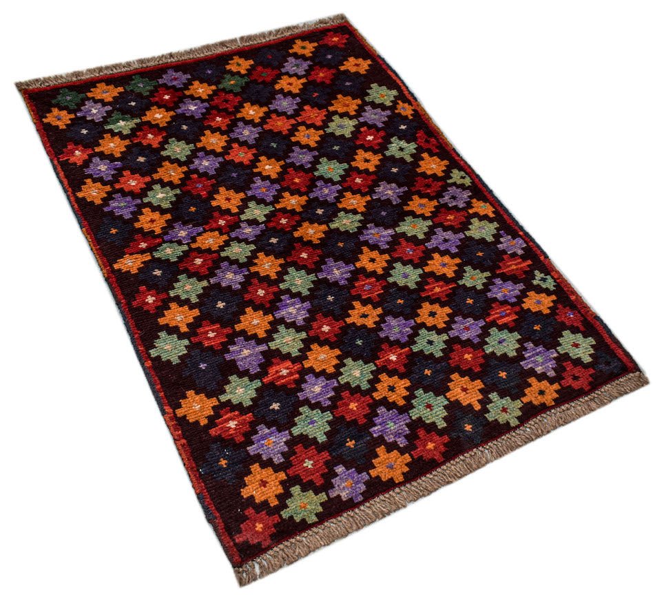 Handmade Afghan Pashm rug featuring a repeating geometric floral pattern in vibrant colors.