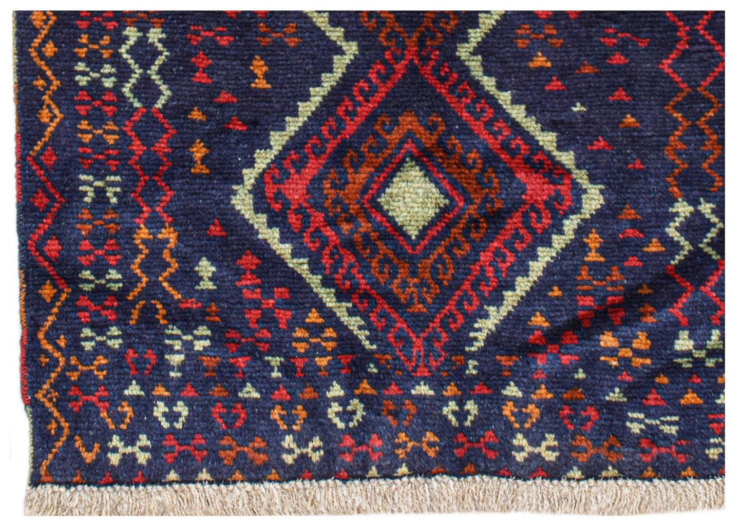 Handmade Afghan Pashm rug featuring a dark blue field with geometric red and ivory diamond motifs.