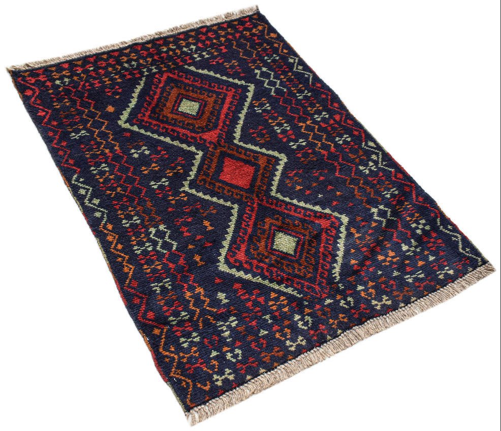 Handmade Afghan Pashm rug featuring a dark blue field with geometric red and ivory patterns.