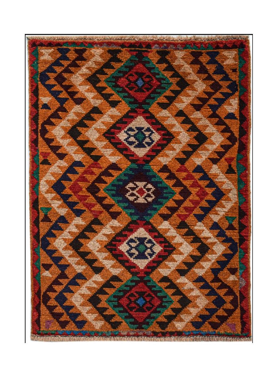 Afghan Pashm rug with a diamond pattern in red, blue, green, and tan.