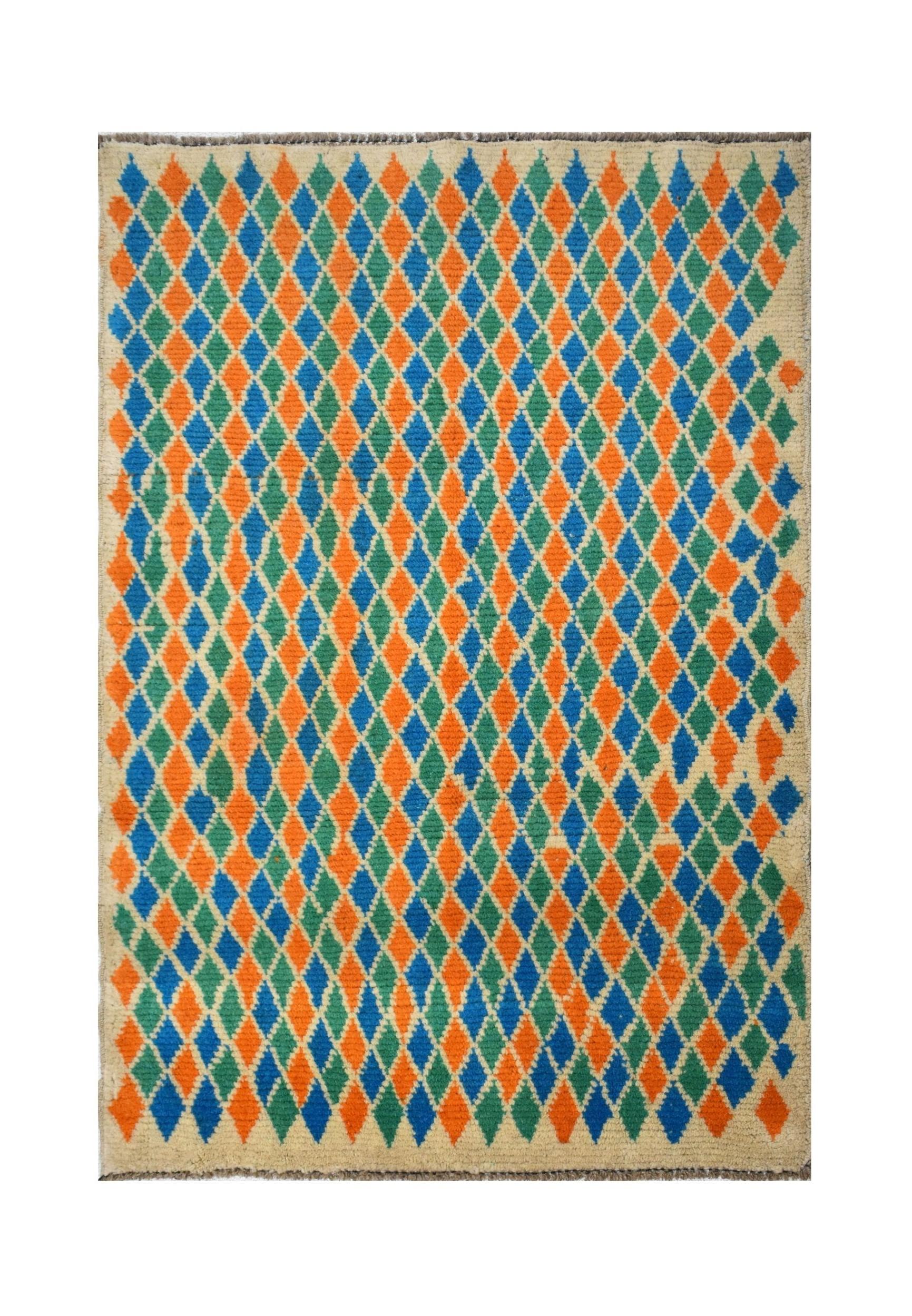 Handmade Afghan wool rug featuring a colorful diamond pattern in blue, orange, and green.