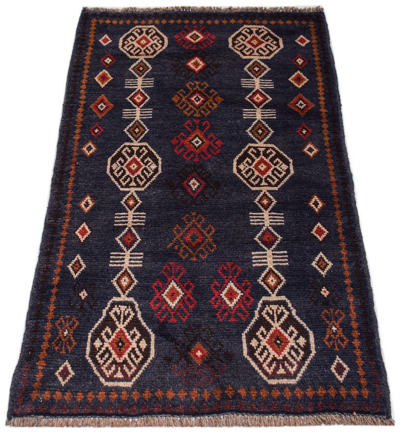 Handmade Afghan Pashm rug featuring geometric tribal patterns in dark blue, red, and ivory wool.