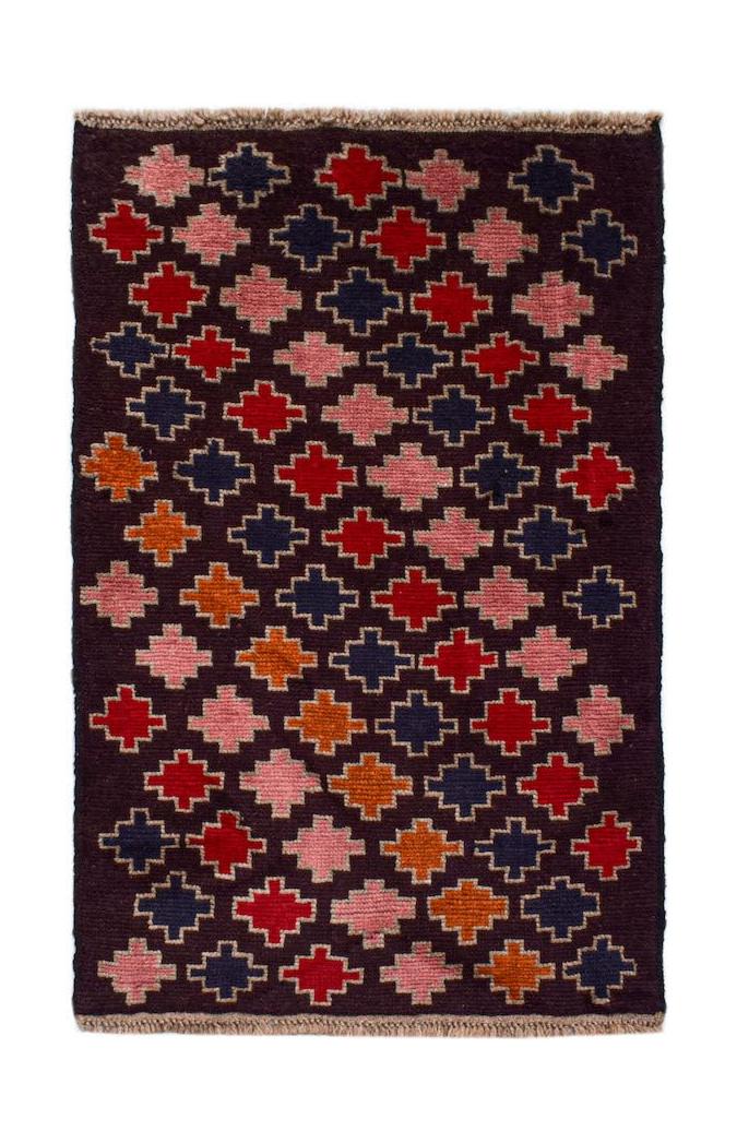 Handmade Afghan Pashm rug featuring a repeating geometric cross pattern in red, blue, and orange.