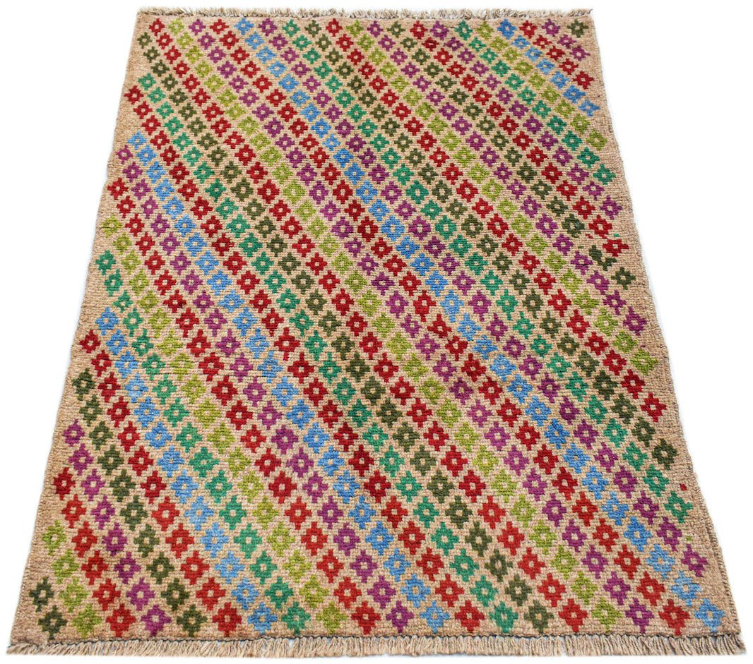 Handmade Afghan Pashm rug featuring a diagonal pattern of colorful floral motifs on a tan base.