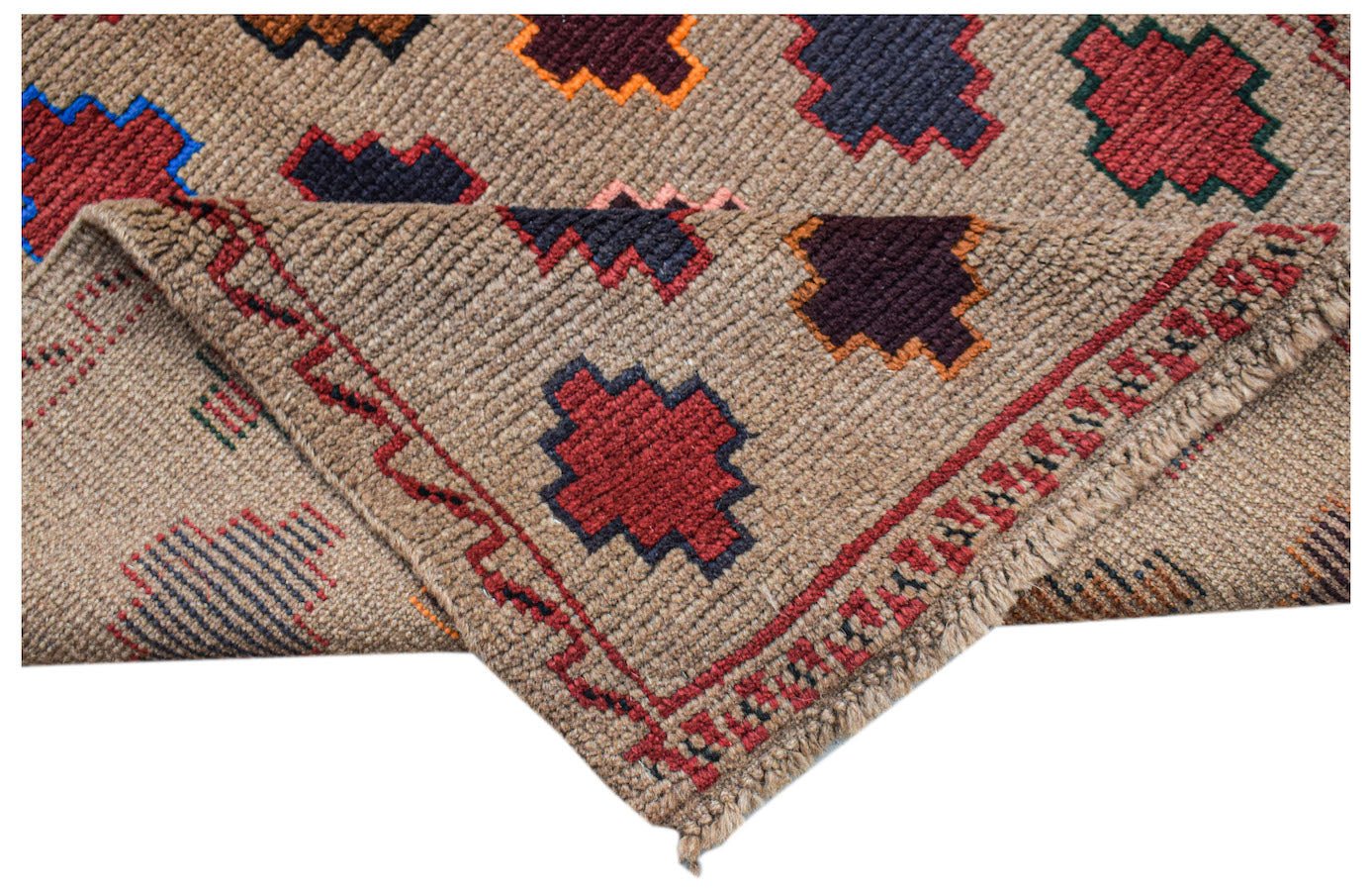 A handmade Afghan Pashm rug featuring geometric tribal patterns in red, blue, and brown tones.