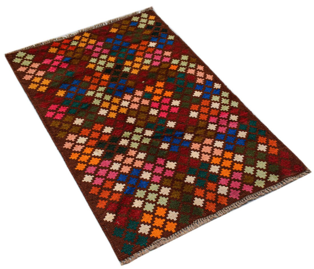 A handmade Afghan Pashm rug featuring a geometric pattern of colorful squares on a brown background.