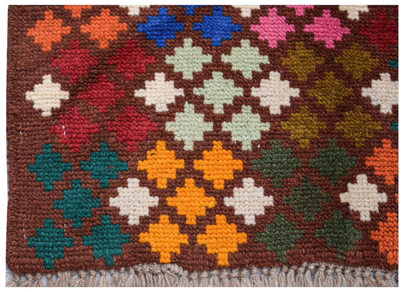 Handmade Afghan Pashm rug featuring a geometric pattern of colorful wool squares on a brown base.
