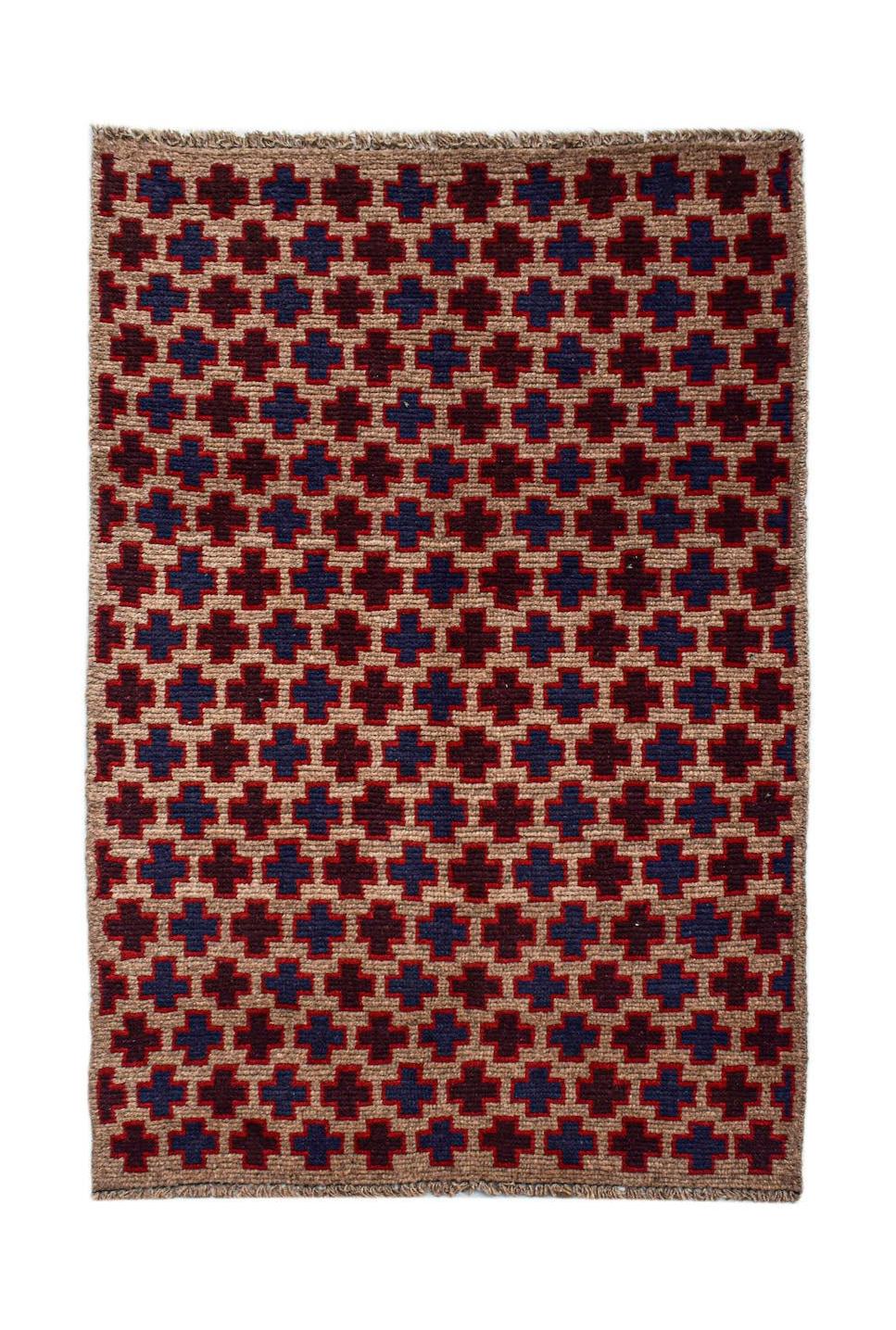 Handmade Afghan Pashm rug featuring a repeating geometric pattern in dark red, blue, and brown.