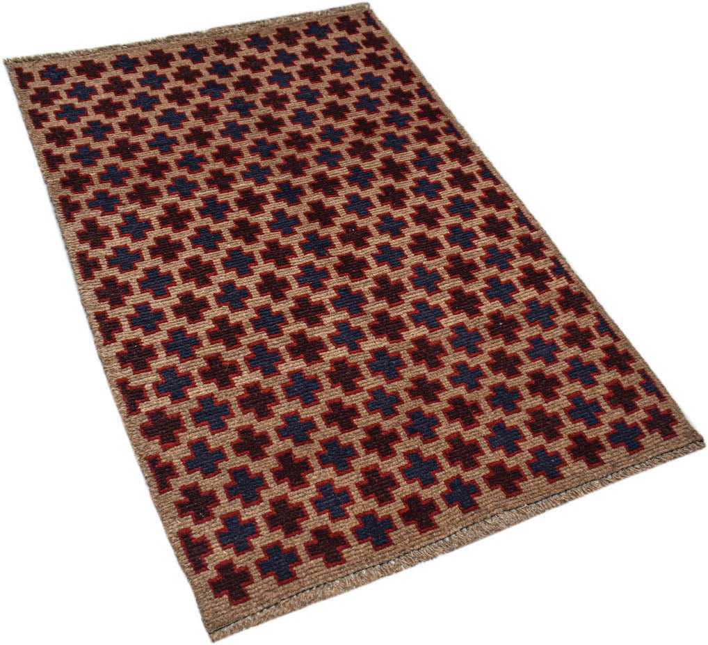 A handmade Afghan Pashm rug featuring a repeating geometric cross pattern in red, blue, and tan.