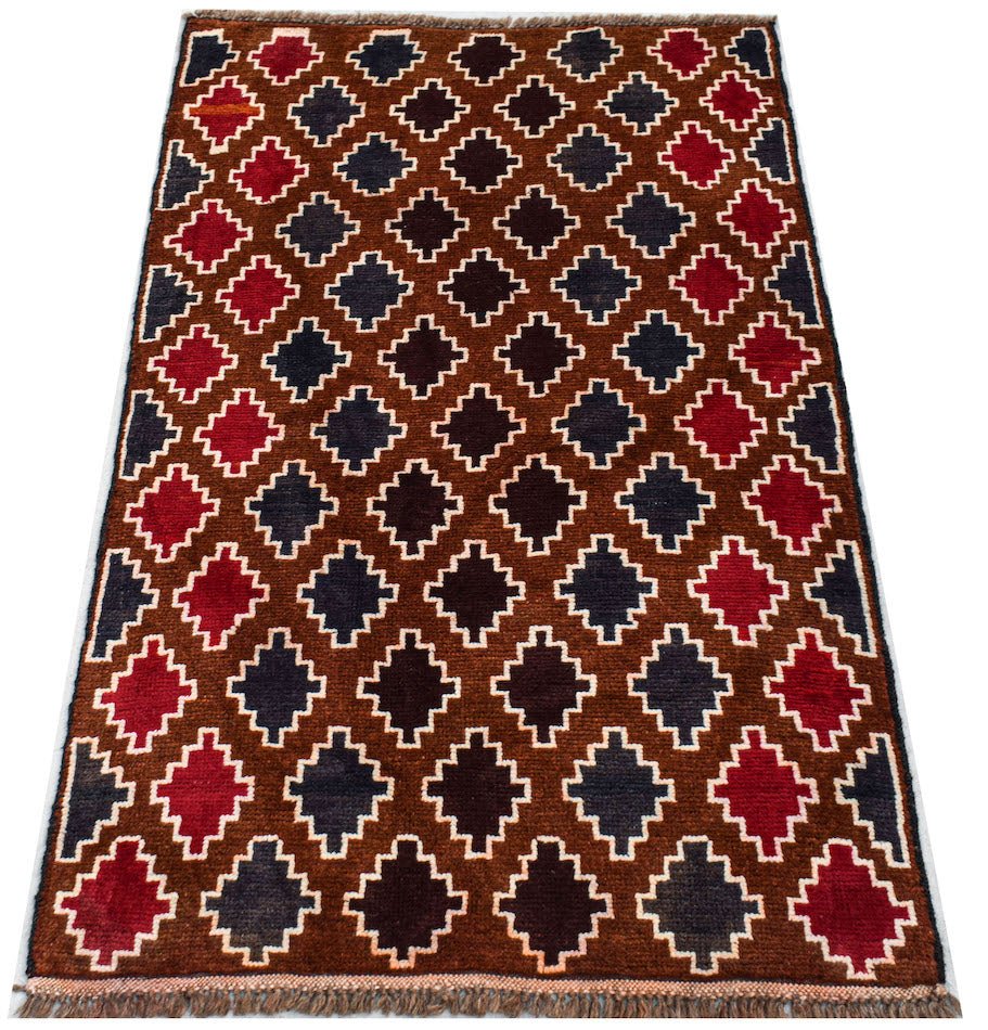 Handmade Afghan Pashm rug featuring a repeating geometric pattern in red, brown, and dark blue.