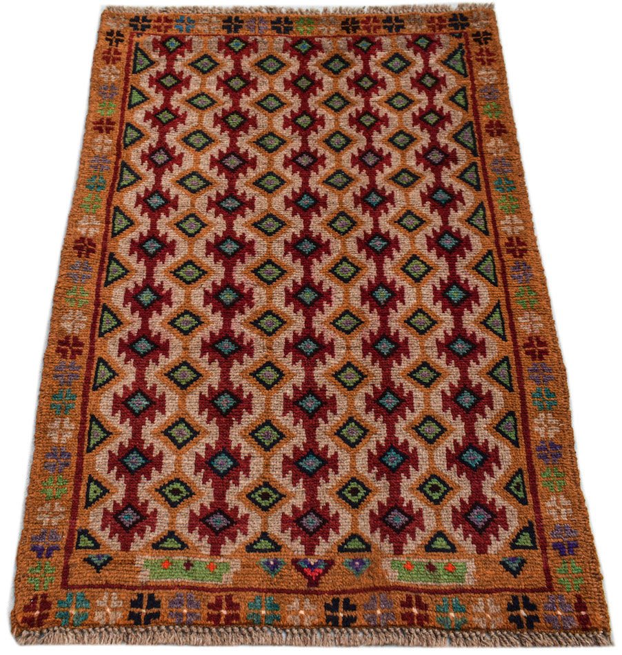 Handmade Afghan Pashm rug featuring a geometric diamond pattern in red, brown, and blue tones.