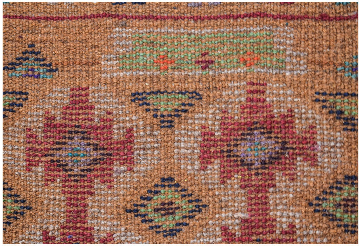 Afghan Pashm Rug with geometric patterns in red, blue, and green on a brown background.