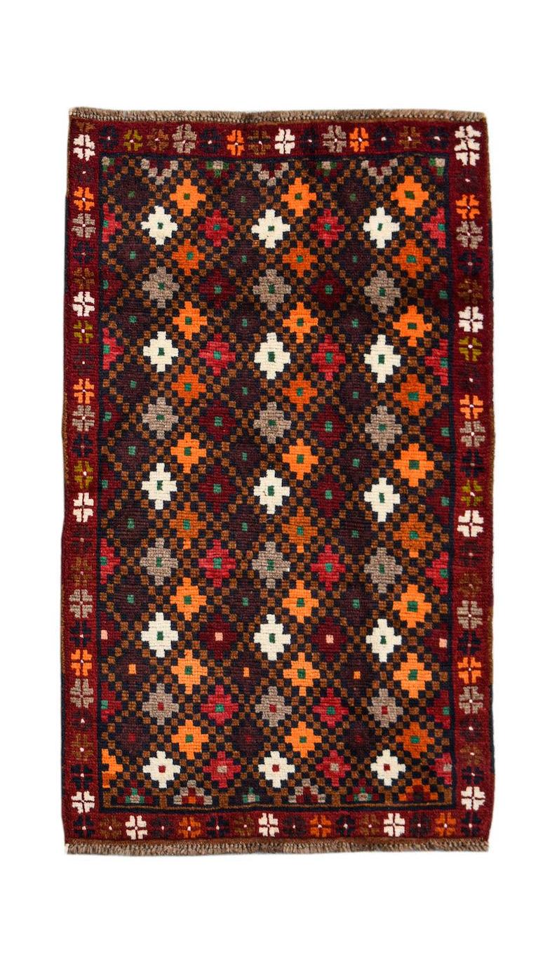 Afghan Pashm Rug with geometric patterns in red, orange, white, and brown.
