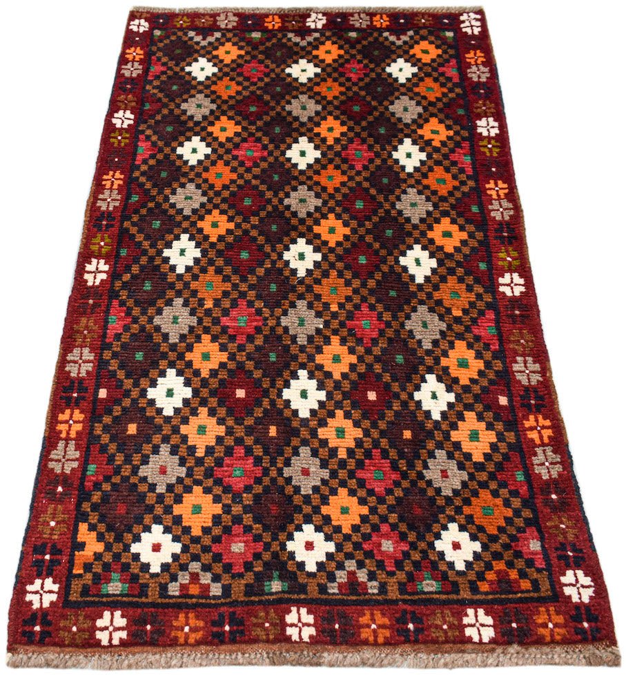 Afghan Pashm rug with a geometric pattern in red, brown, and orange.