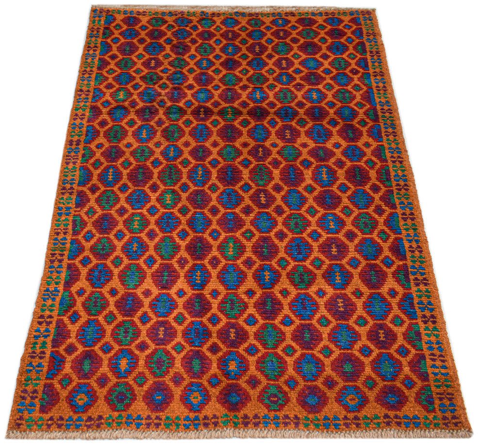 Handmade Afghan Pashm rug featuring a repeating geometric diamond pattern in red, blue, and green.