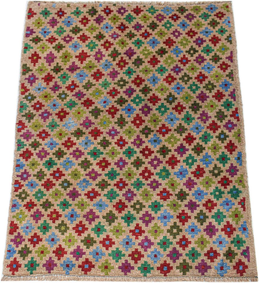 Handmade Afghan Pashm rug featuring a repeating colorful geometric floral pattern on a tan base.