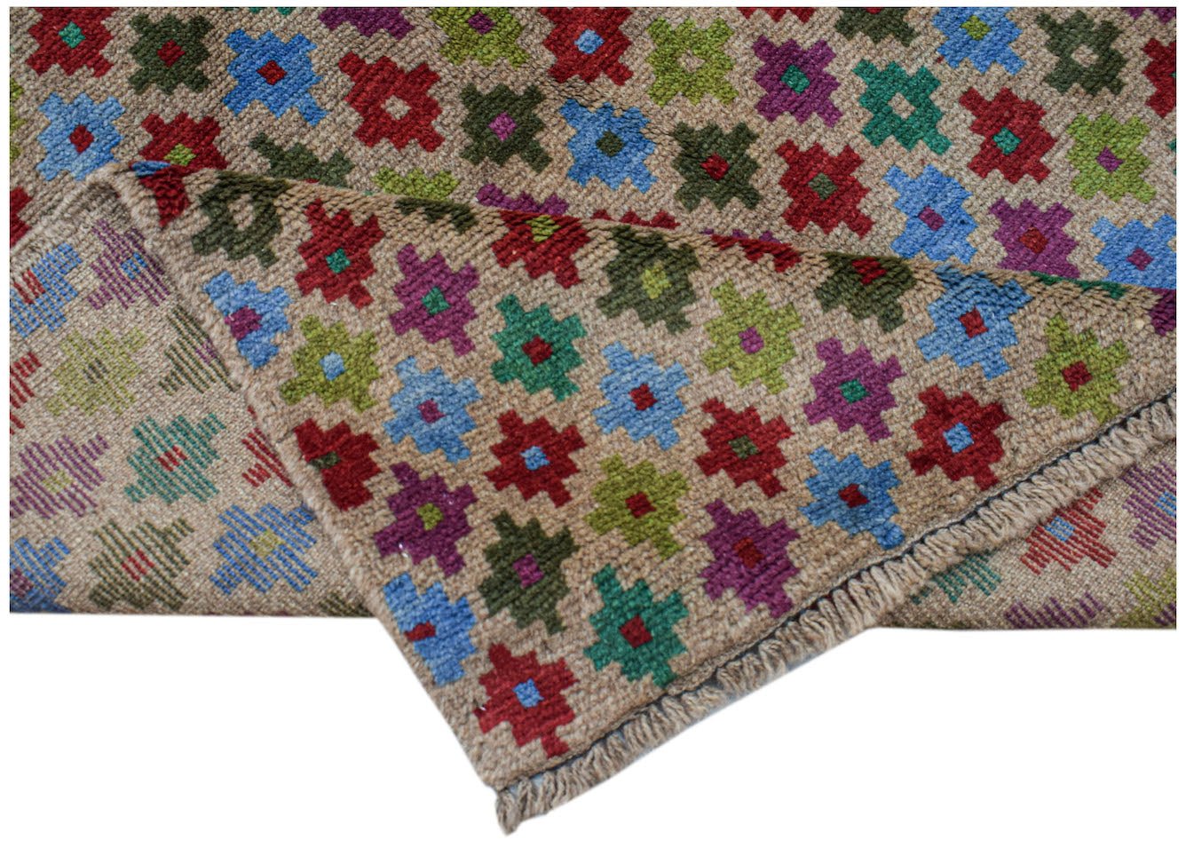 A handmade Afghan Pashm rug featuring a repeating pattern of colorful geometric floral motifs.