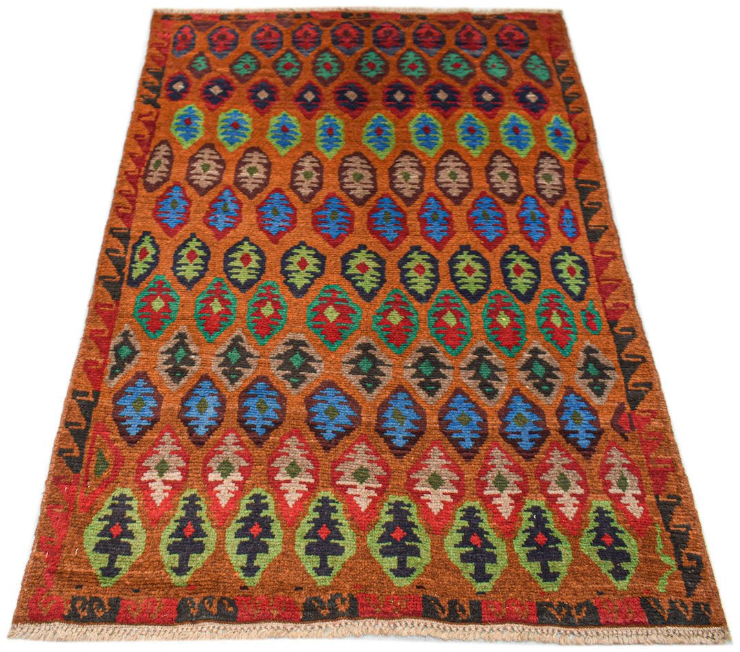 Handmade Afghan Pashm rug featuring a repeating diamond pattern in vibrant multi-colored wool.