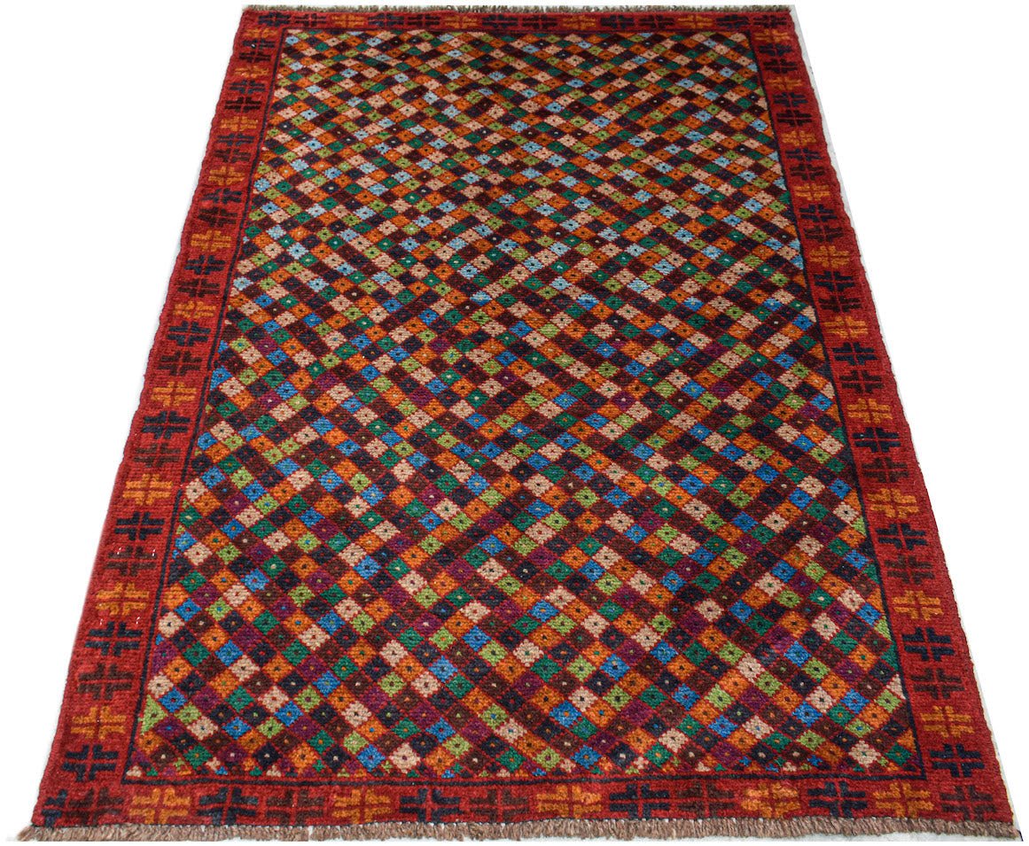 Handmade Afghan Pashm rug featuring a colorful diamond pattern on a dark red background.