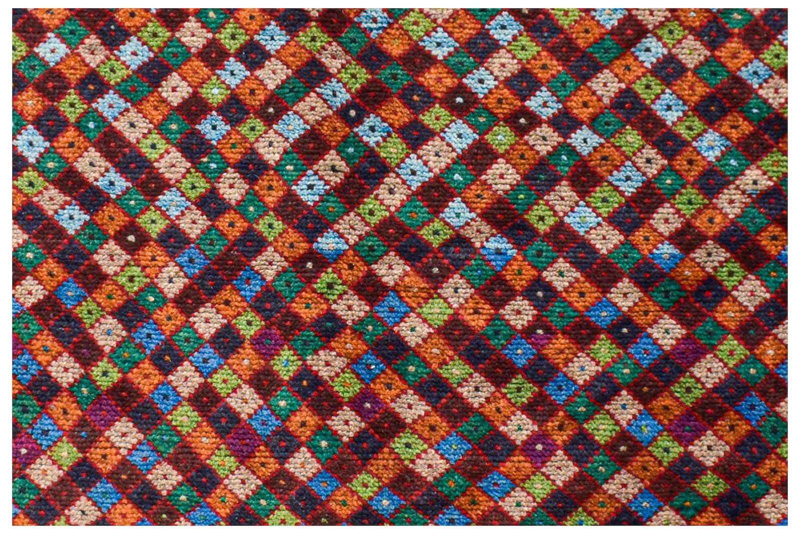 Handmade Afghan Pashm rug featuring a vibrant, multicolored diamond pattern in wool.