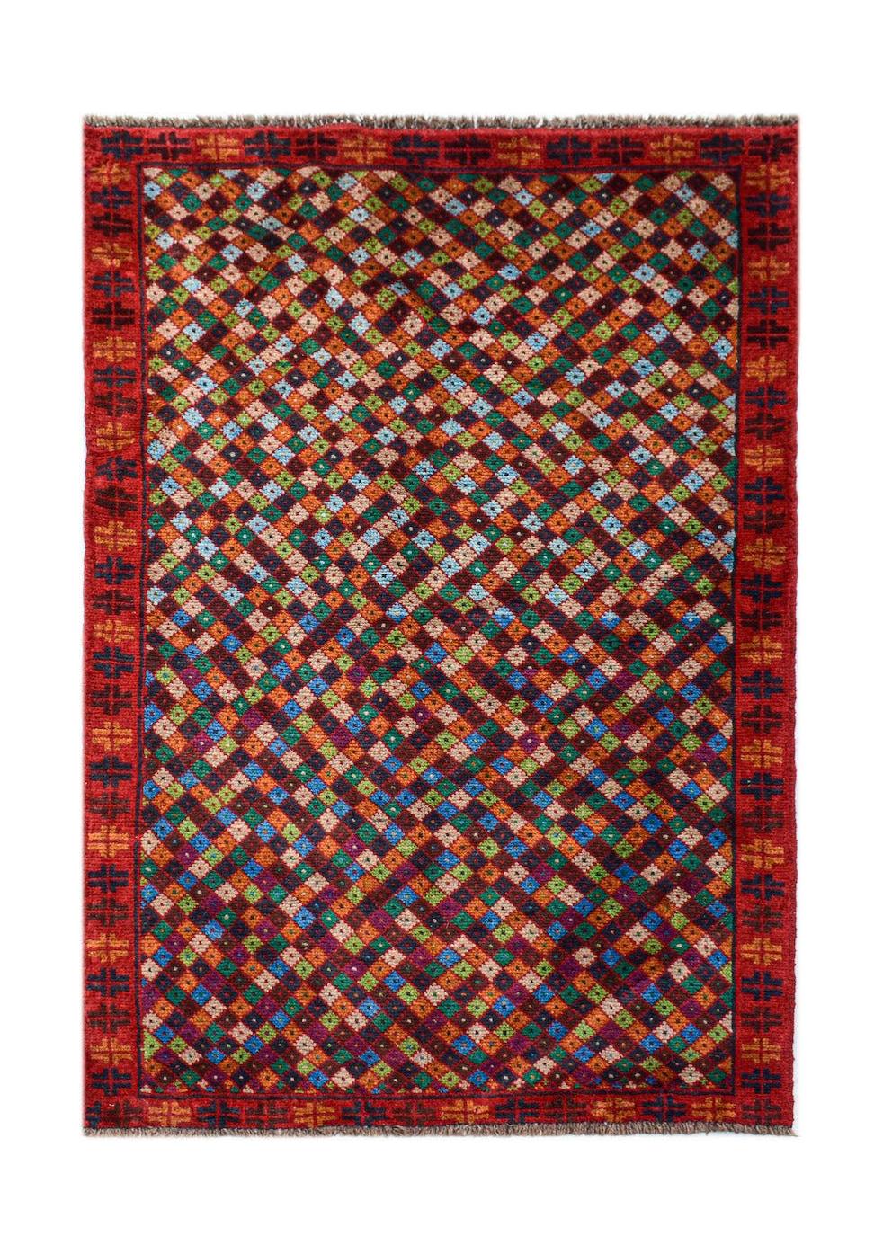 Handmade Afghan Pashm rug featuring a colorful geometric diamond pattern on a dark red background.