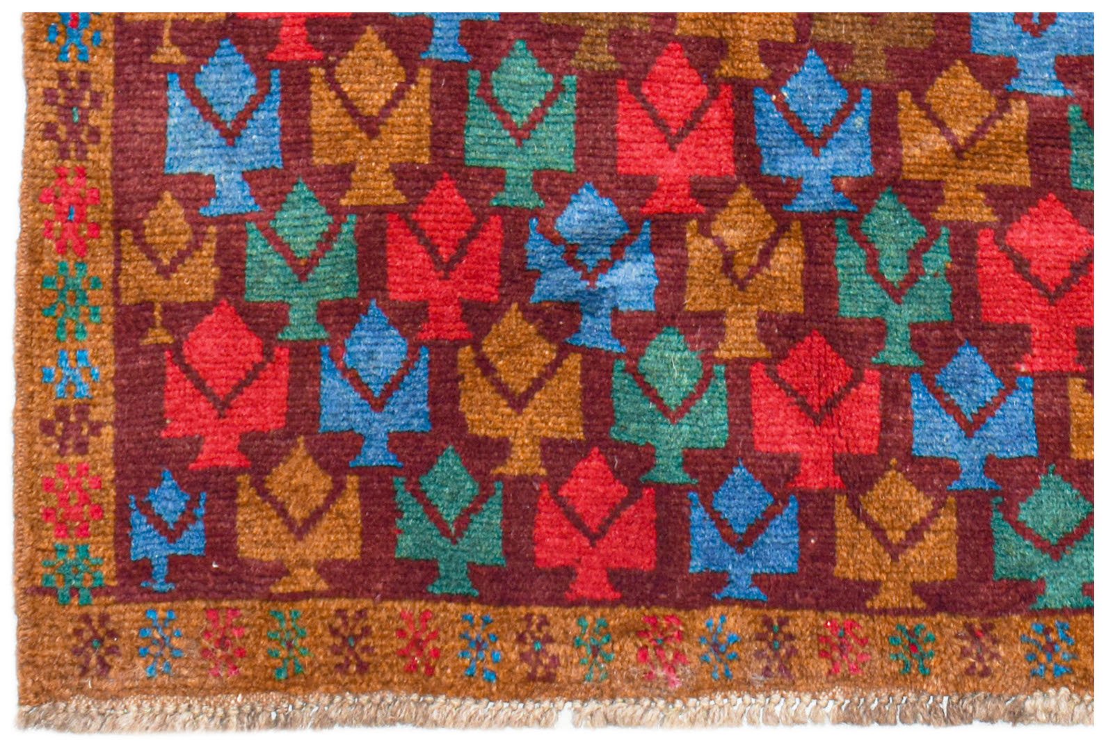 Handmade Afghan Pashm rug featuring a repeating geometric tree pattern in red, blue, and brown.
