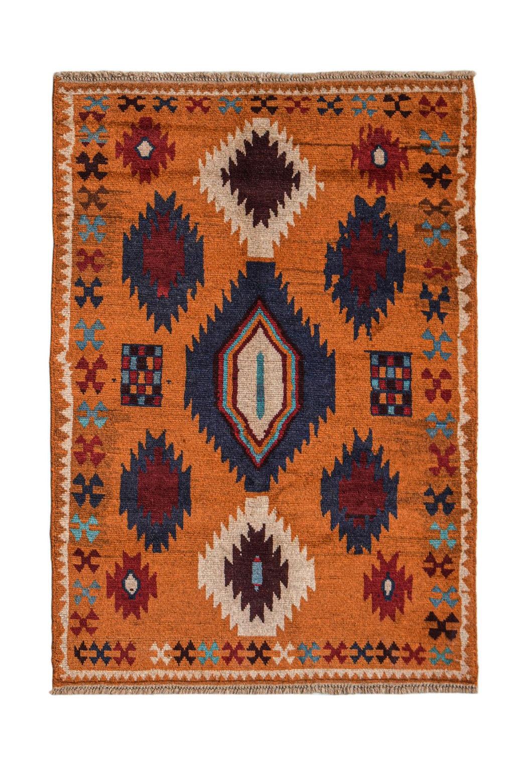 Handmade Afghan Pashm rug featuring a geometric tribal pattern in orange, blue, and dark red.