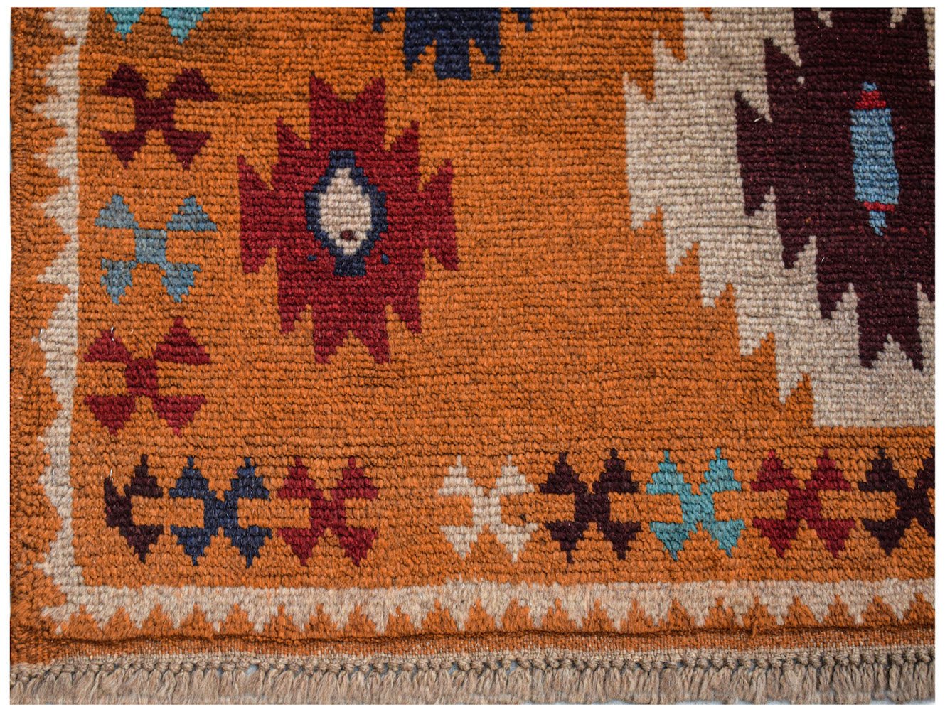 Handmade Afghan Pashm rug featuring tribal geometric patterns in red, blue, and ivory on orange.