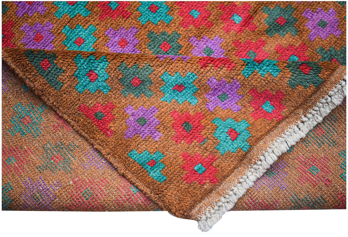 Handmade Afghan Pashm rug featuring a geometric floral pattern in red, teal, and purple on brown.