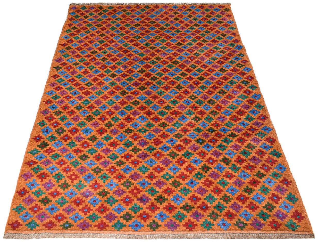 Handmade Afghan Pashm rug featuring a repeating geometric floral pattern in orange, blue, and red.