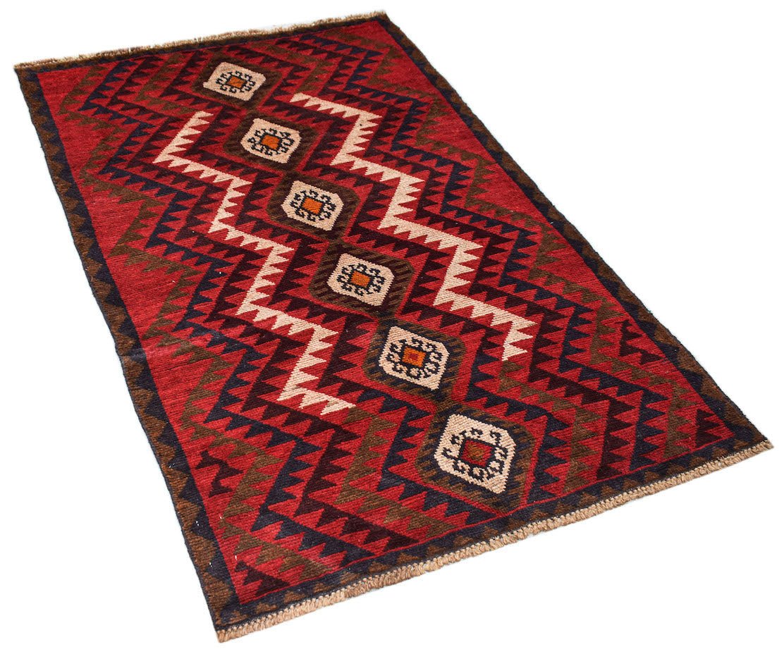 Handmade Afghan Pashm rug featuring a geometric tribal pattern in red, brown, and ivory wool.