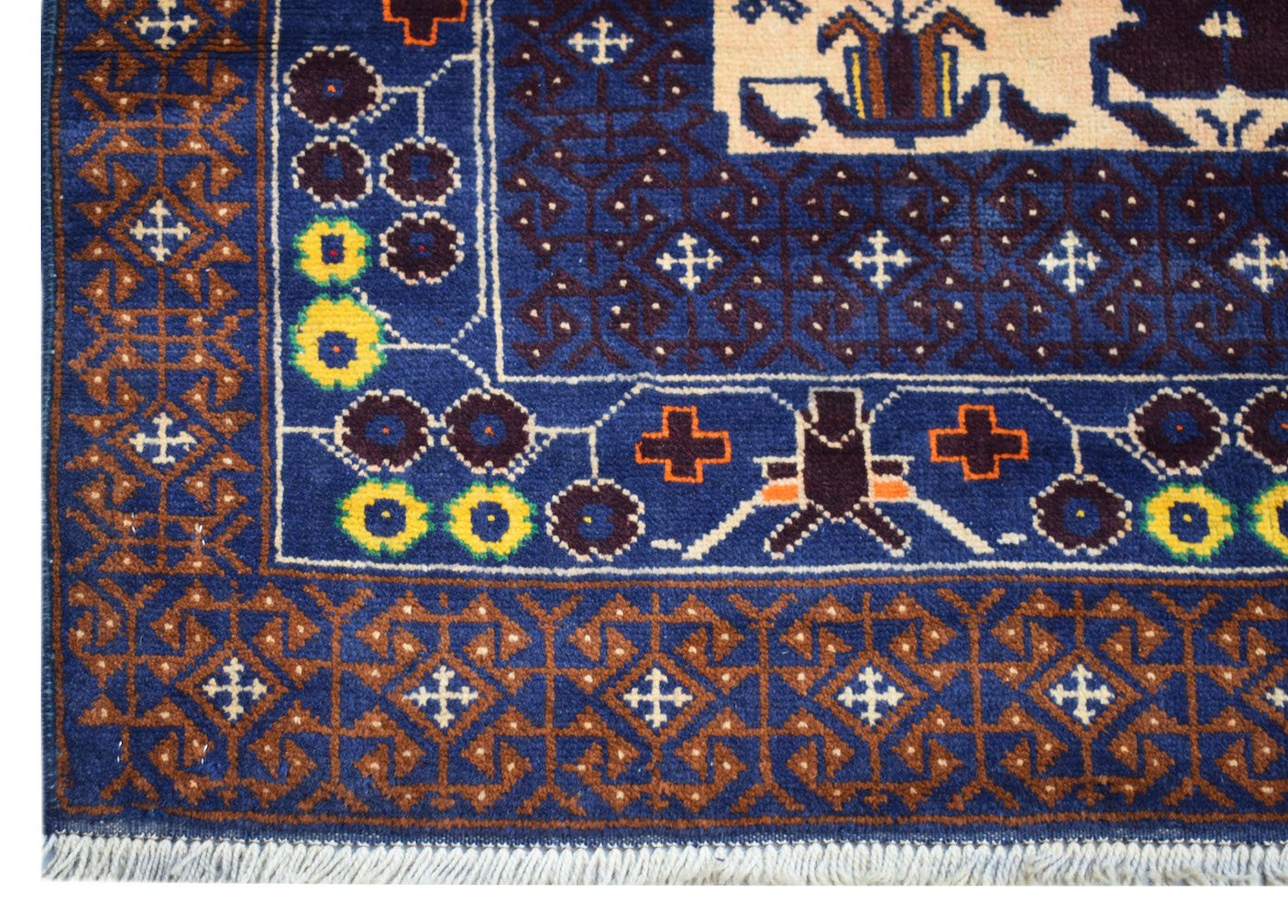 Handmade Afghan Pashm rug featuring a geometric tribal pattern in blue, brown, and ivory tones.